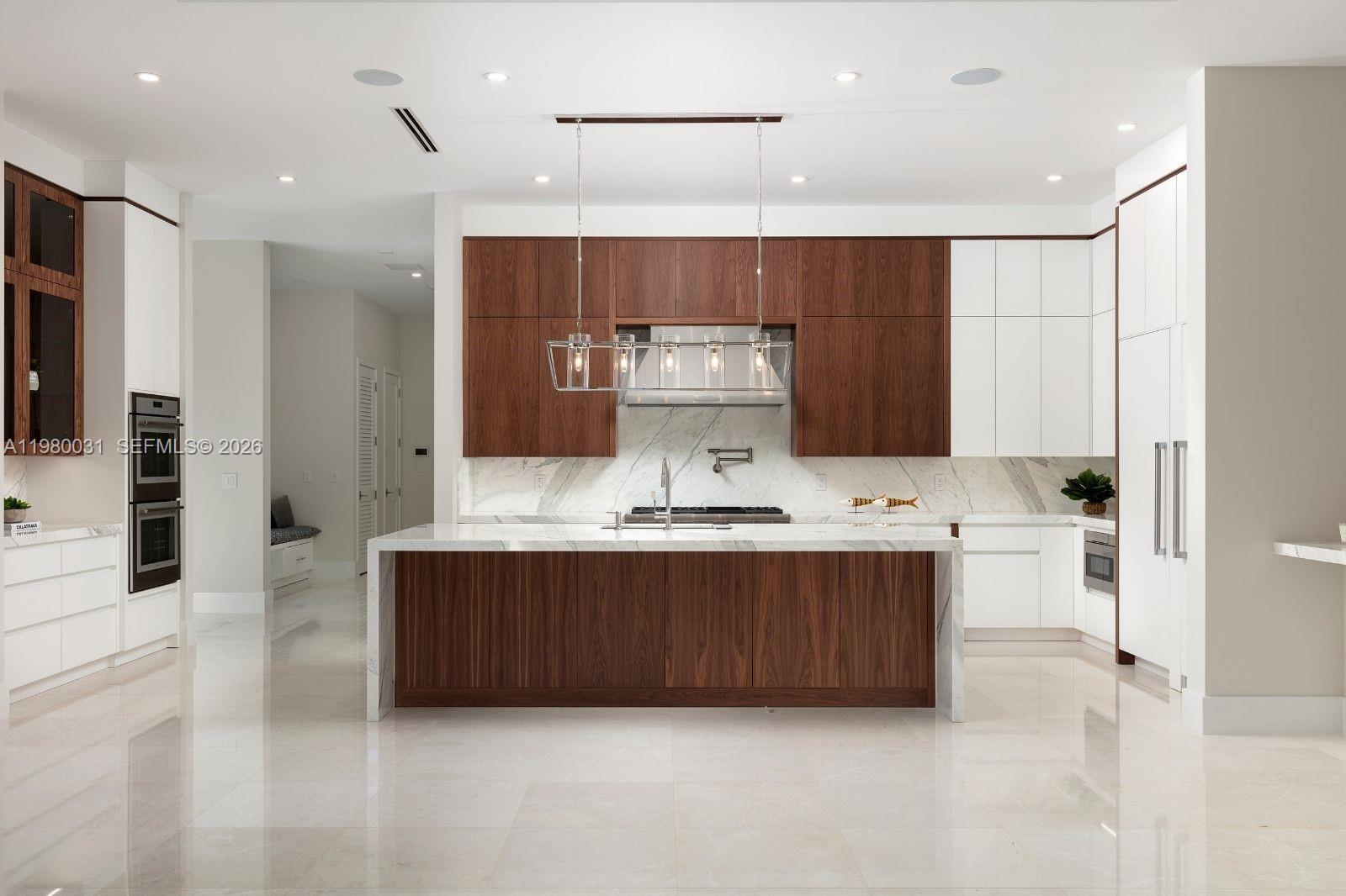 6065 Southwest 109th Street Pinecrest, FL 33156 - Photo 10 of 28 a view of kitchen with stainless steel appliances kitchen island sink refrigerator and cabinets
