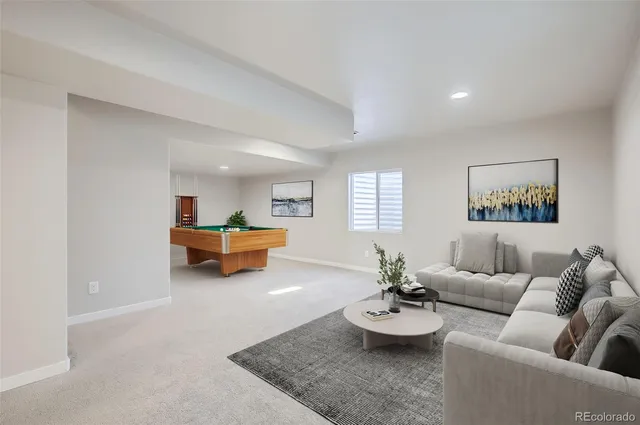a living room with furniture and window
