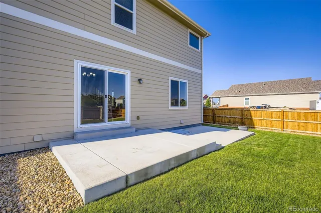 a view of a backyard of the house
