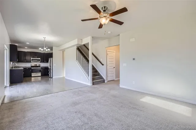 a view of a livingroom with a ceiling fan