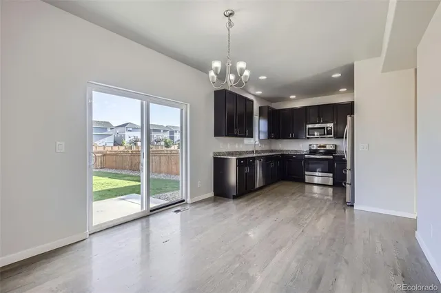 a view of a kitchen with microwave and cabinets