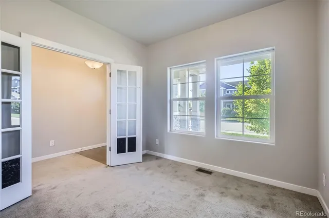 an empty room with windows