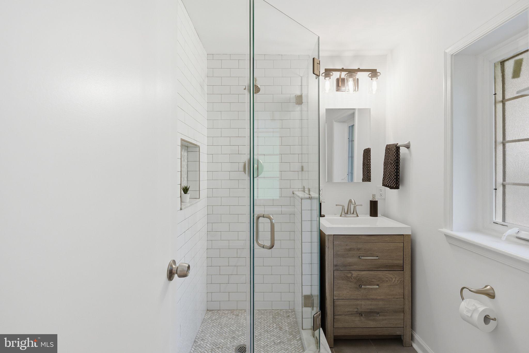 5 Brookside Circle Wayne, PA 19087 - Photo 27 of 49 a bathroom with a double vanity sink a mirror and shower