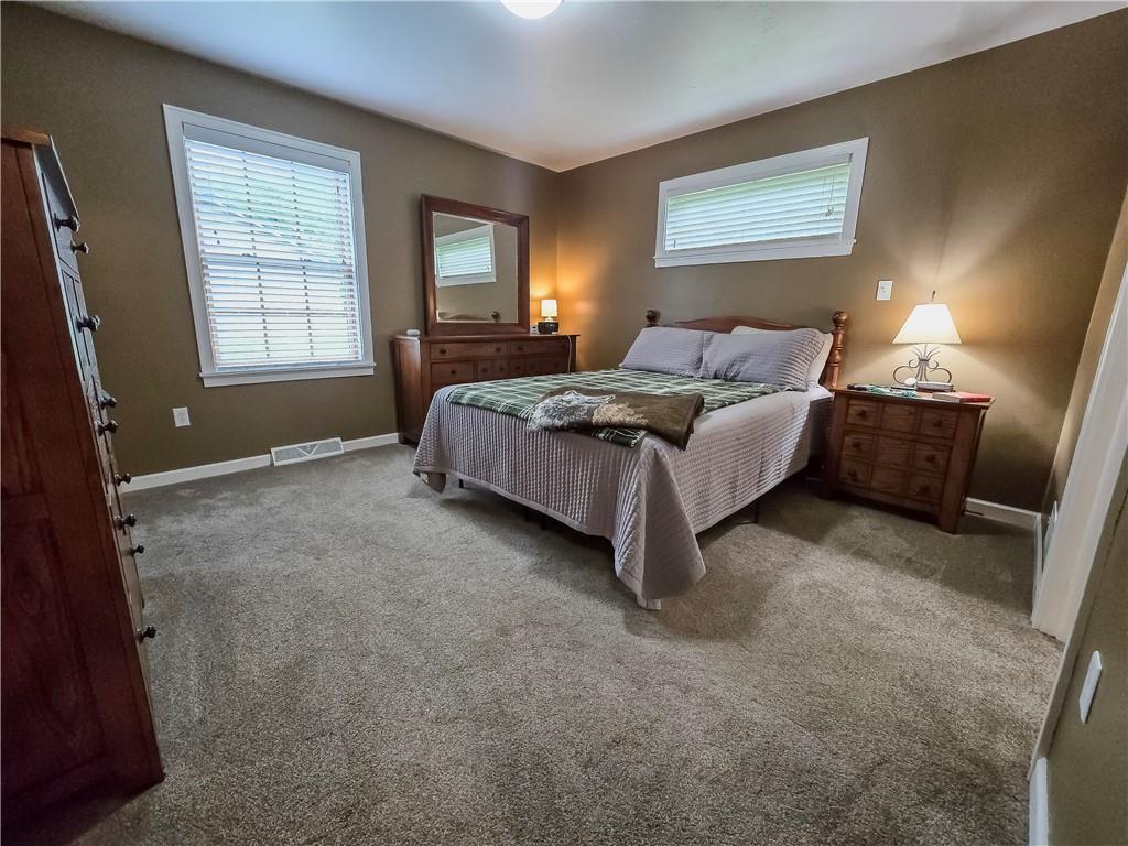 277 Dunn Road Greensburg, PA 15601 - Photo 12 of 24 a bedroom with a bed and wooden floor