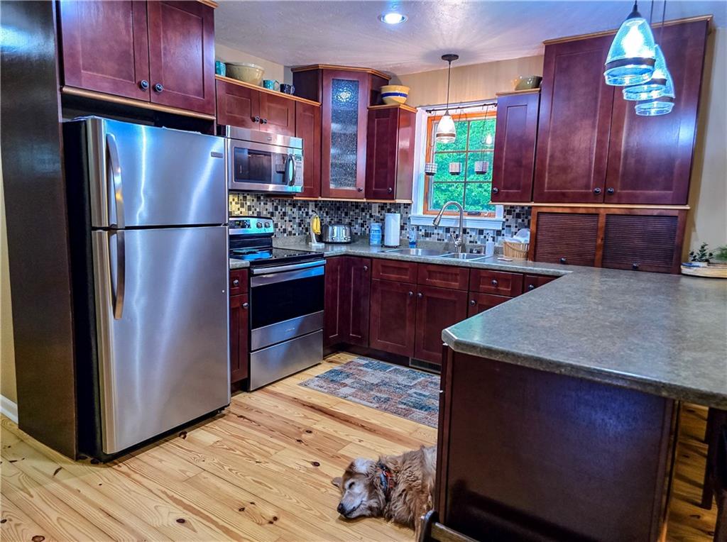277 Dunn Road Greensburg, PA 15601 - Photo 4 of 24 a kitchen with stainless steel appliances granite countertop a refrigerator and a sink