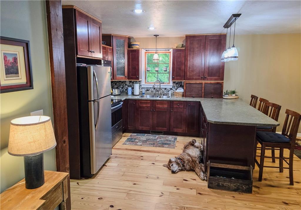 277 Dunn Road Greensburg, PA 15601 - Photo 5 of 24 a kitchen with a table chairs and refrigerator