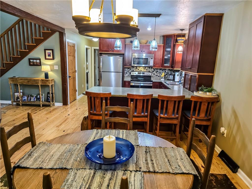 277 Dunn Road Greensburg, PA 15601 - Photo 6 of 24 a view of a dining room with furniture and a chandelier