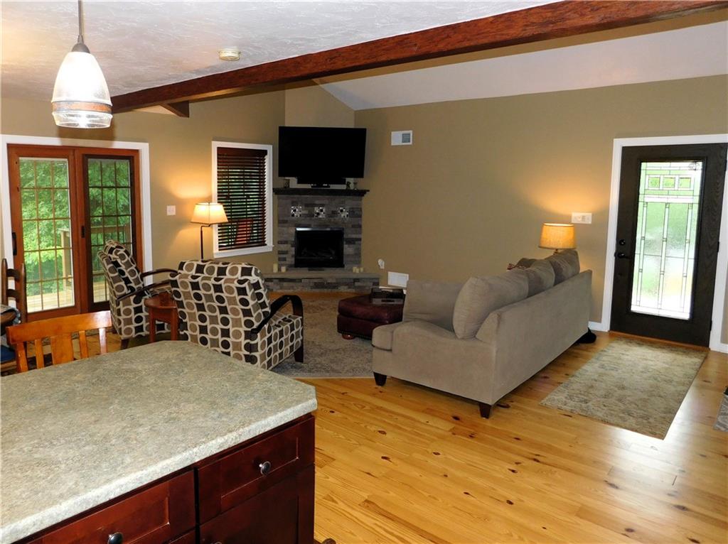 277 Dunn Road Greensburg, PA 15601 - Photo 8 of 24 a living room with furniture and a flat screen tv