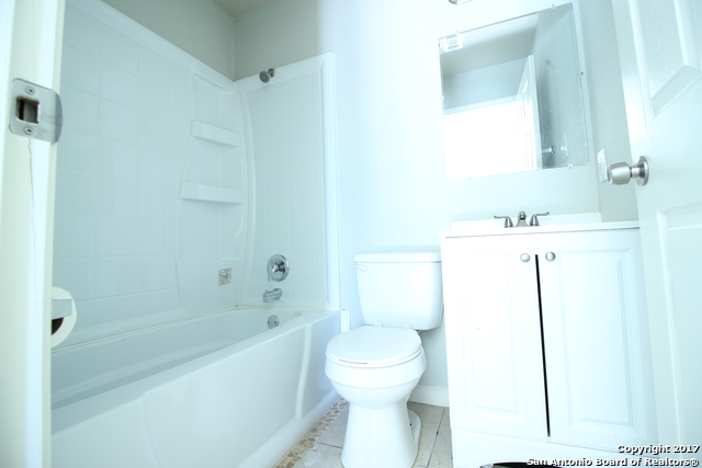 6551 Spring Time Street, Unit 304 San Antonio, TX 78249 - Photo 4 of 9 a bathroom with a sink a toilet and shower