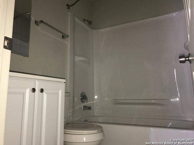 6551 Spring Time Street, Unit 304 San Antonio, TX 78249 - Photo 8 of 9 a bathroom with a shower and toilet