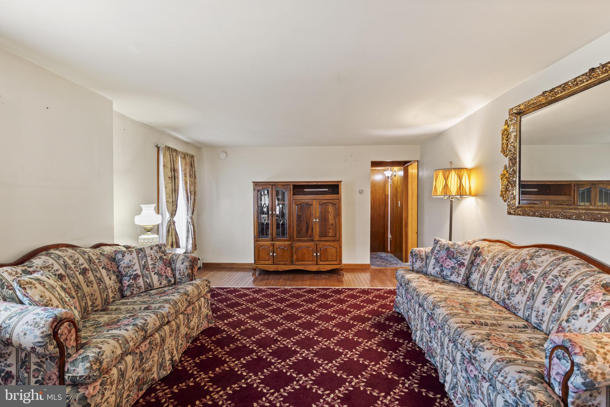 4114 Old Washington Road Westminster, MD 21157 - Photo 16 of 34 a living room with a couch and a window