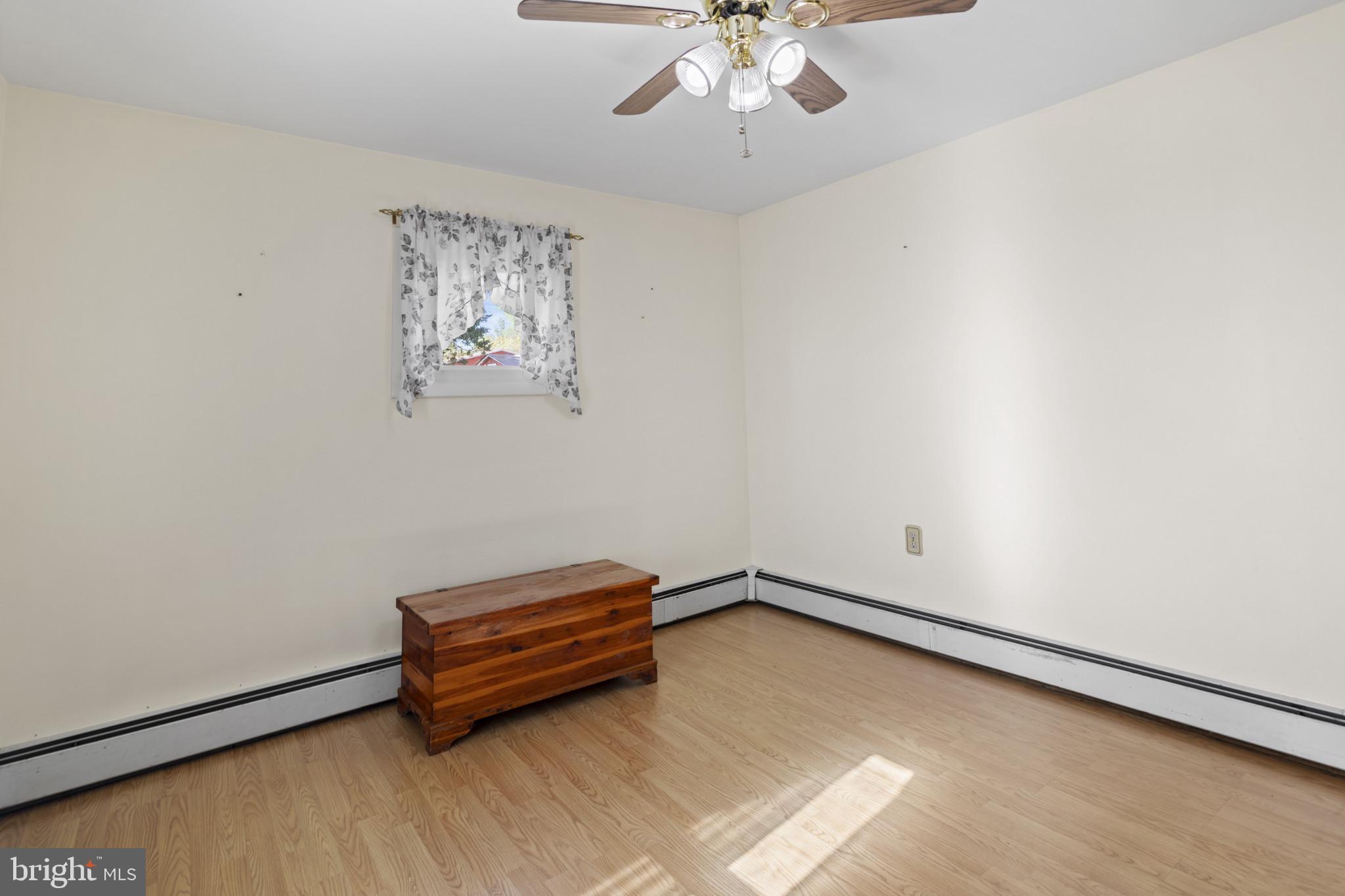 4114 Old Washington Road Westminster, MD 21157 - Photo 21 of 34 a room with a window and a ceiling fan