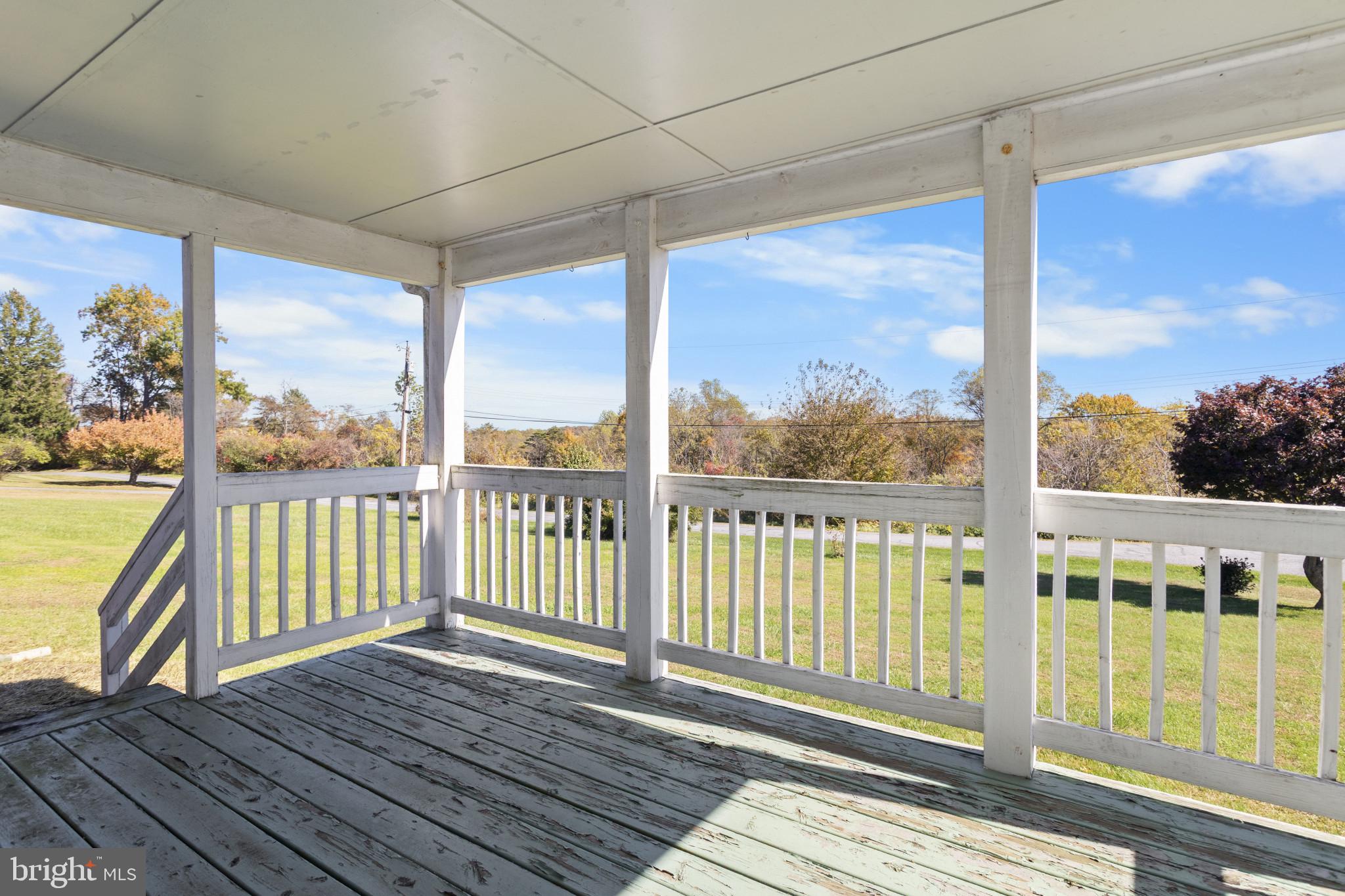 4114 Old Washington Road Westminster, MD 21157 - Photo 3 of 34 a view of a balcony with wooden floor