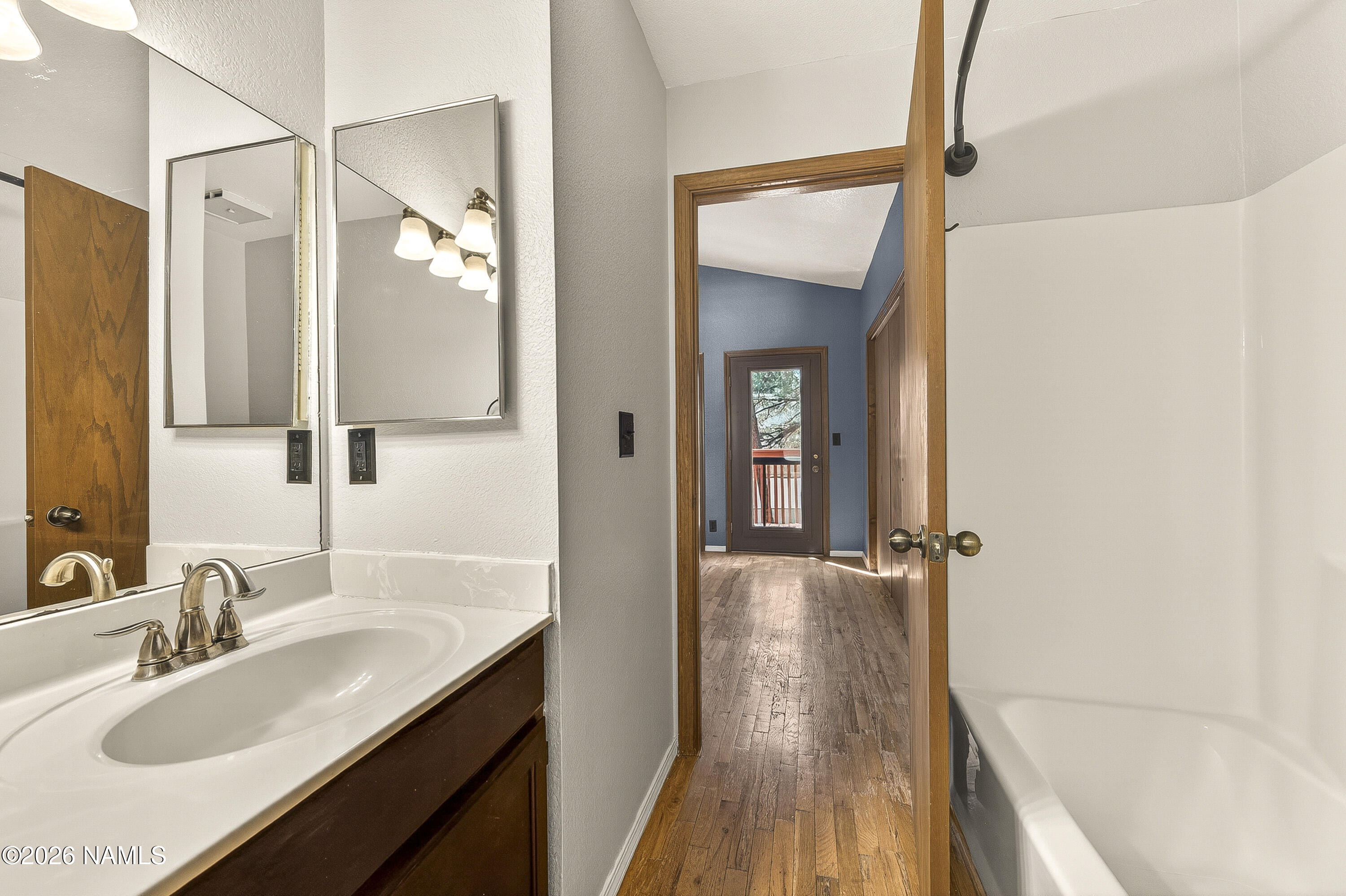 4005 South Lake Mary Road, Unit 9 Flagstaff, AZ 86005 - Photo 24 of 31 a bathroom with a sink and a mirror