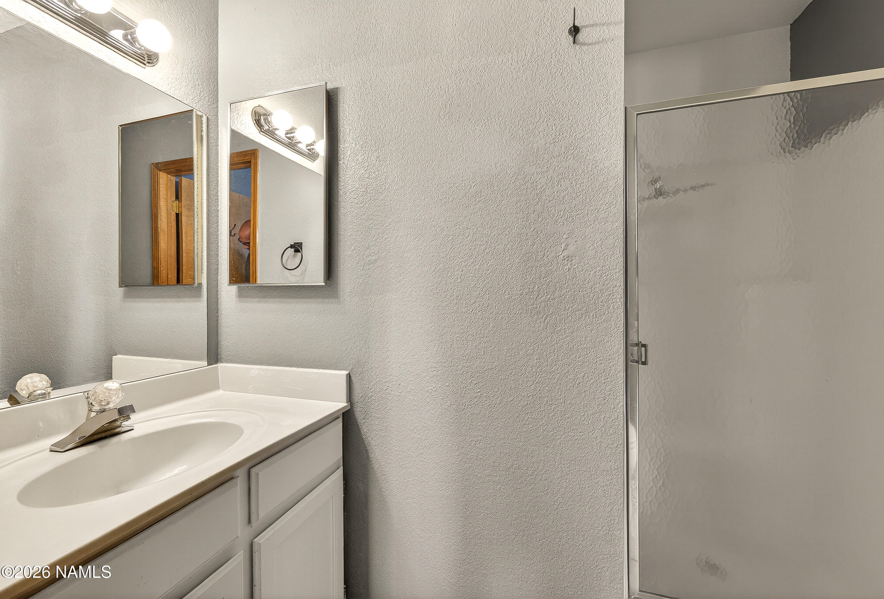 4005 South Lake Mary Road, Unit 9 Flagstaff, AZ 86005 - Photo 28 of 31 a bathroom with a sink and a mirror