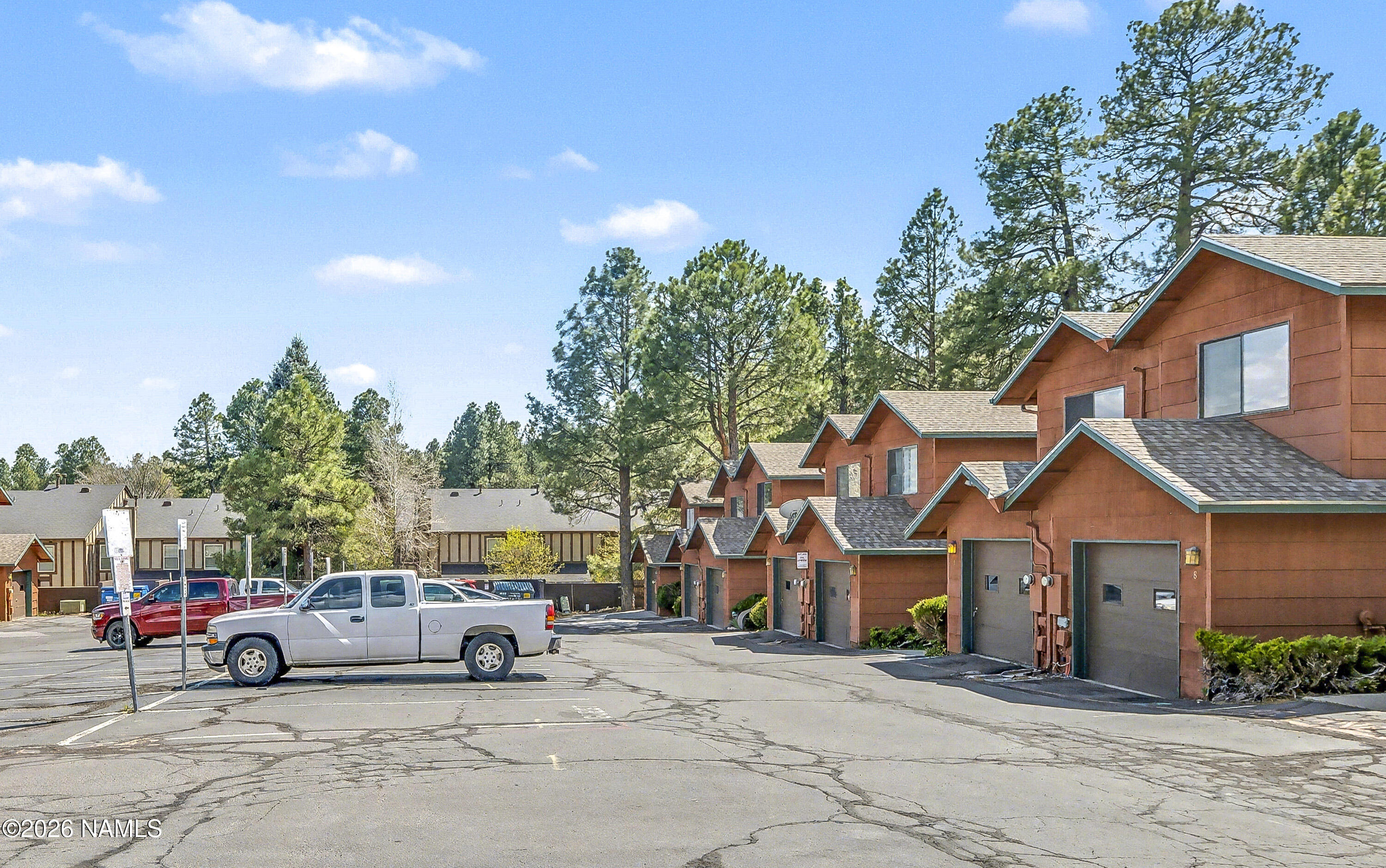 4005 South Lake Mary Road, Unit 9 Flagstaff, AZ 86005 - Photo 29 of 31 a view of building with parked cars