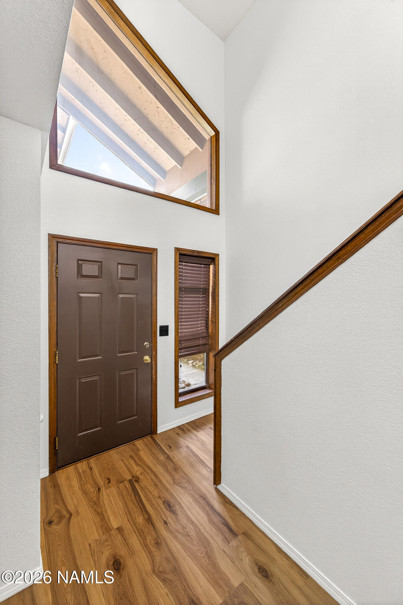 4005 South Lake Mary Road, Unit 9 Flagstaff, AZ 86005 - Photo 3 of 31 a view of a hallway with wooden floor and entryway