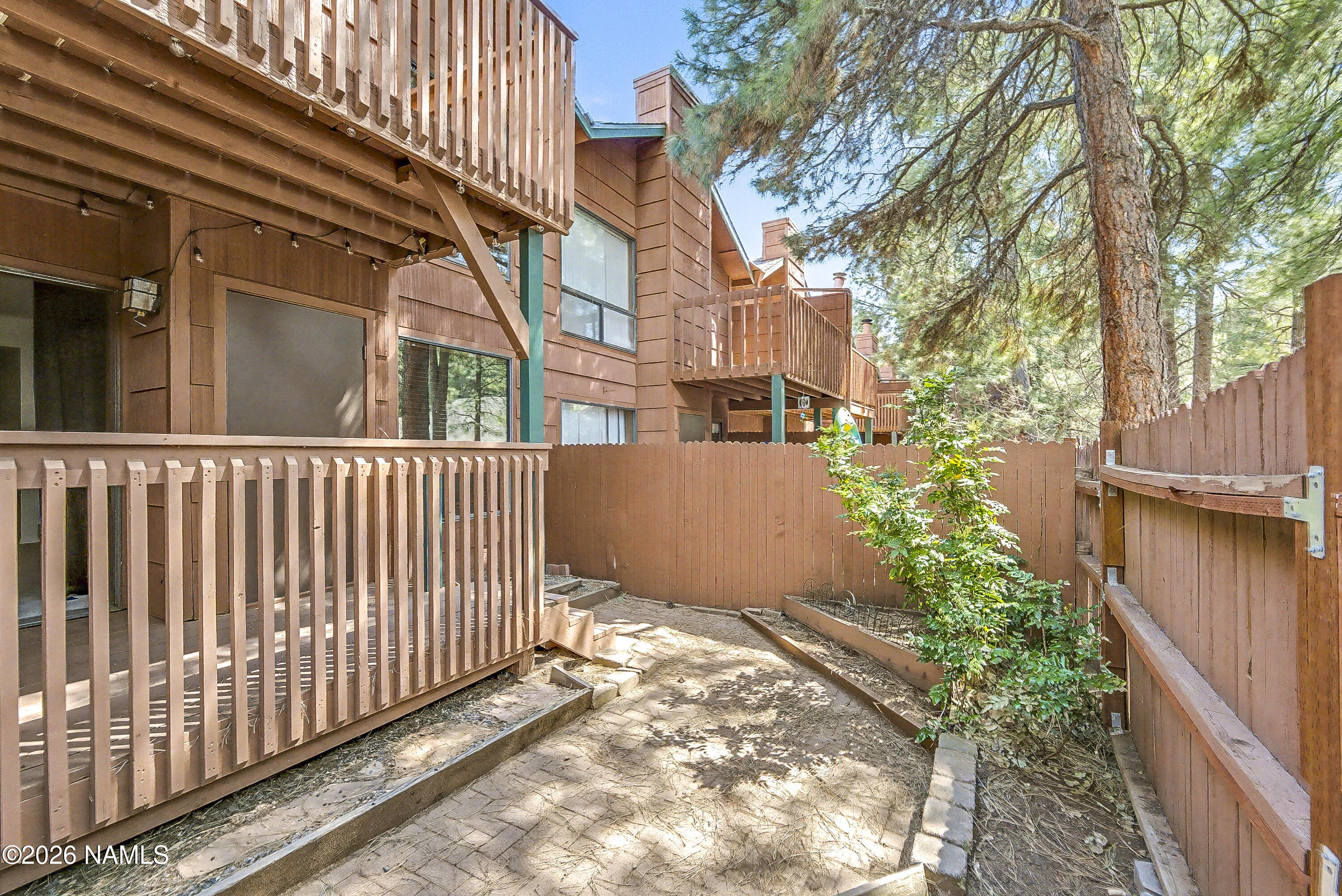 4005 South Lake Mary Road, Unit 9 Flagstaff, AZ 86005 - Photo 8 of 31 a view of a house with a small yard