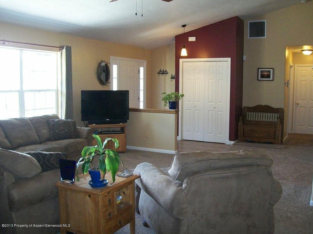 690 Birch Court Rifle, CO 81650 - Photo 6 of 17 a living room with furniture and a flat screen tv