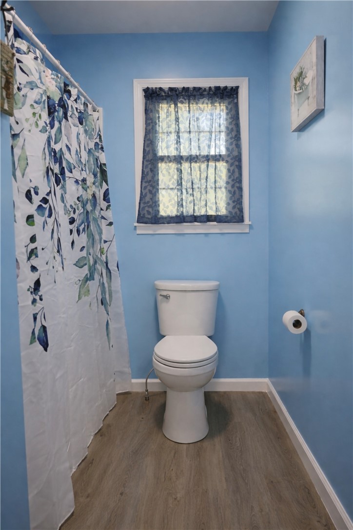9432 Highway 81 Iva, SC 29655 - Photo 14 of 19 This bathroom features durable flooring and a window for natural light, creating a bright and airy atmosphere.
