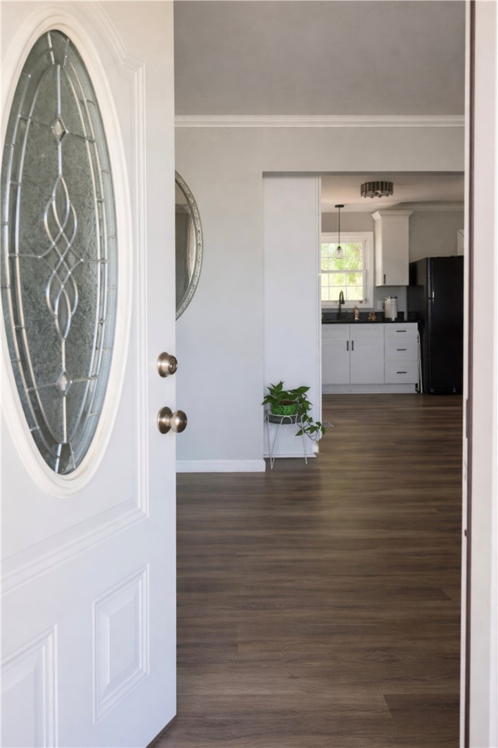 9432 Highway 81 Iva, SC 29655 - Photo 3 of 19 Step into this inviting home, featuring warm wood floors that extend into the well-appointed kitchen.