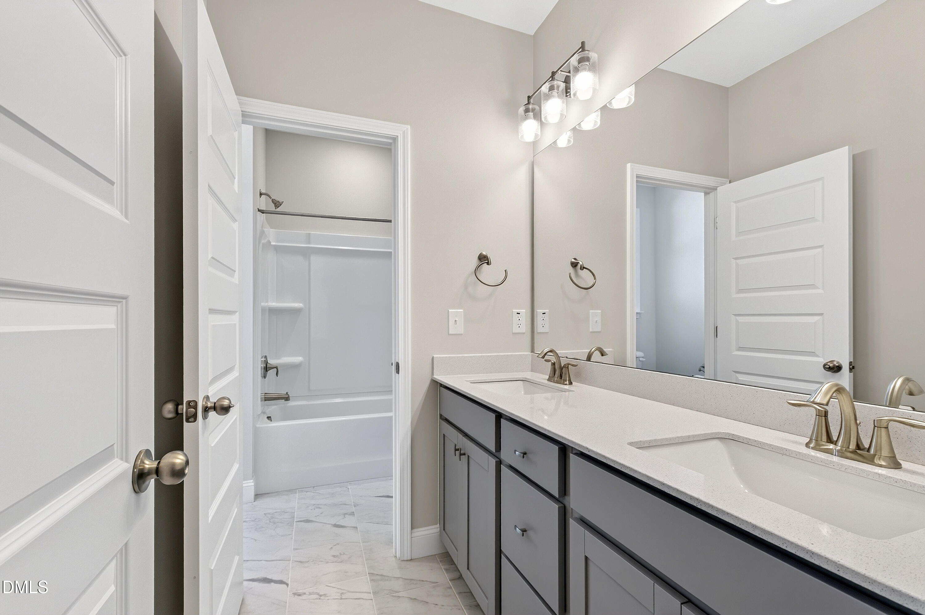 1300 Commons Ford Place Apex, NC 27539 - Photo 54 of 70 a bathroom with a granite countertop sink a toilet a mirror and shower