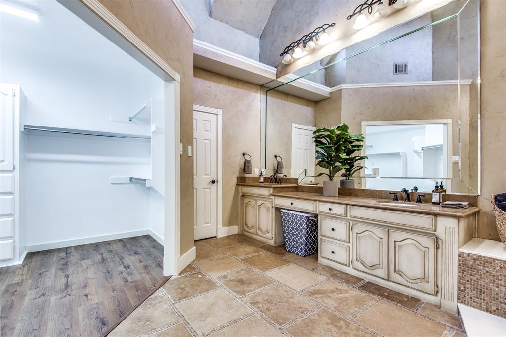 3400 Snidow Drive Plano, TX 75025 - Photo 16 of 25 a spacious bathroom with a granite countertop sink a mirror and a shower