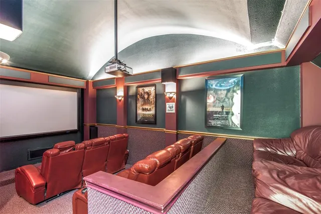 a living room with furniture a floor to ceiling window and flat screen tv