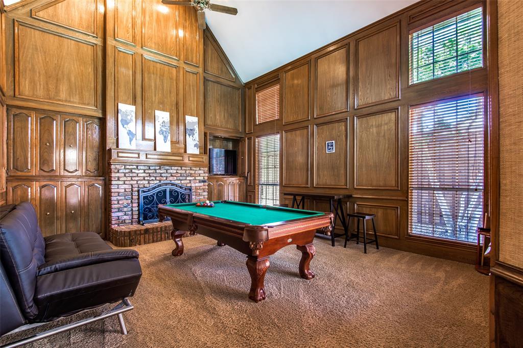 3400 Snidow Drive Plano, TX 75025 - Photo 24 of 25 a living room with furniture a fireplace and large windows