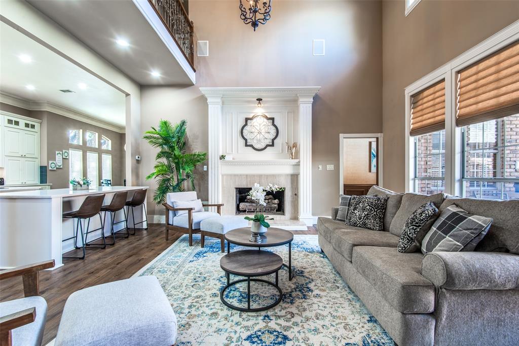 3400 Snidow Drive Plano, TX 75025 - Photo 5 of 25 a living room with furniture a fireplace and a large window