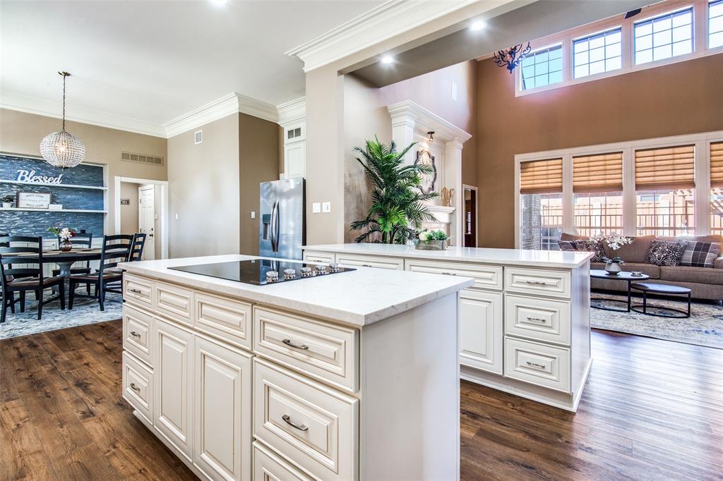3400 Snidow Drive Plano, TX 75025 - Photo 7 of 25 a kitchen with counter top space and wooden floor