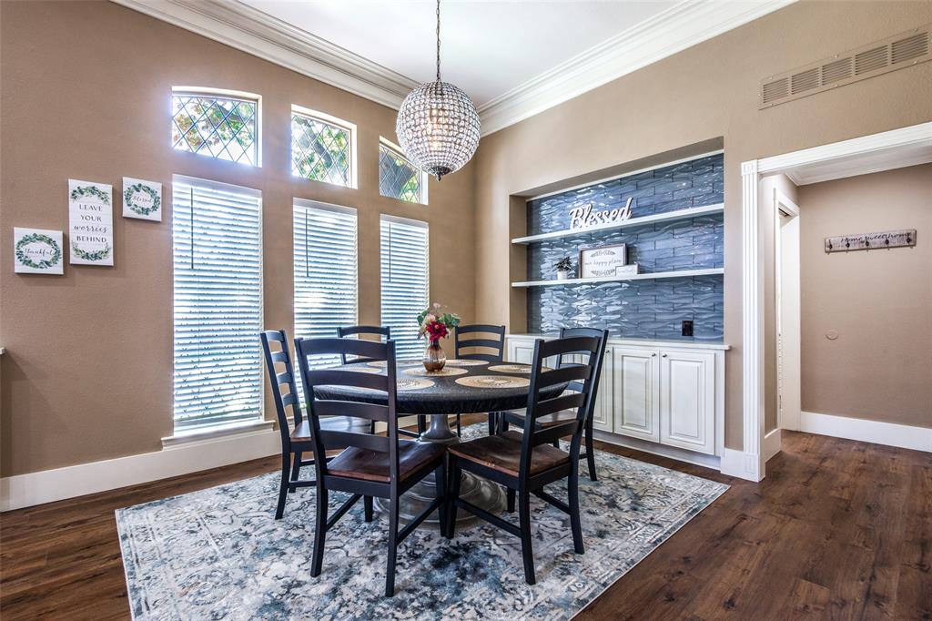 3400 Snidow Drive Plano, TX 75025 - Photo 9 of 25 a view of a dining room with furniture window and wooden floor