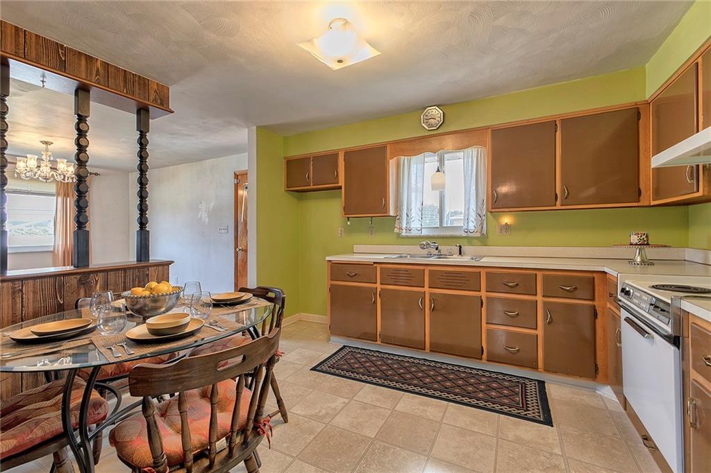 501 Ridgeview Road Mount Pleasant, PA 15666 - Photo 11 of 35 a kitchen with a table chairs and a sink