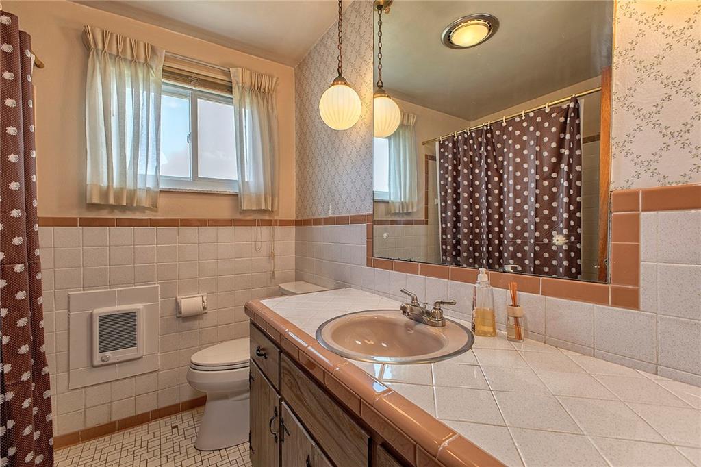 501 Ridgeview Road Mount Pleasant, PA 15666 - Photo 15 of 35 a bathroom with a sink a toilet and a shower