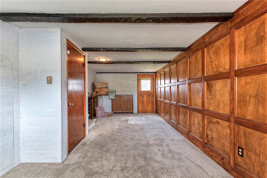 501 Ridgeview Road Mount Pleasant, PA 15666 - Photo 24 of 35 a view of a hallway with wooden floor and staircase
