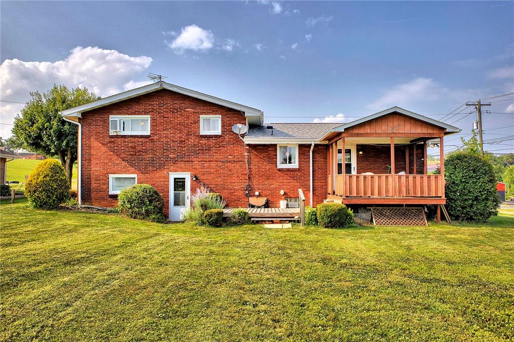 501 Ridgeview Road Mount Pleasant, PA 15666 - Photo 29 of 35 a front view of a house with garden