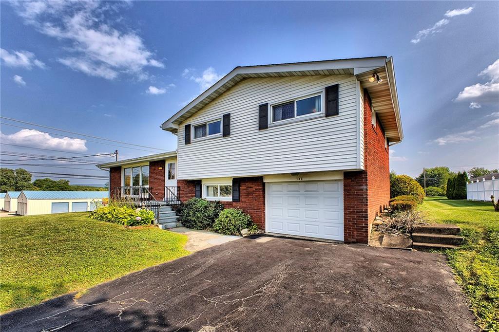 501 Ridgeview Road Mount Pleasant, PA 15666 - Photo 34 of 35 a front view of a house with garden