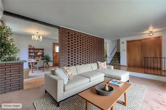 a living room with furniture and a rug