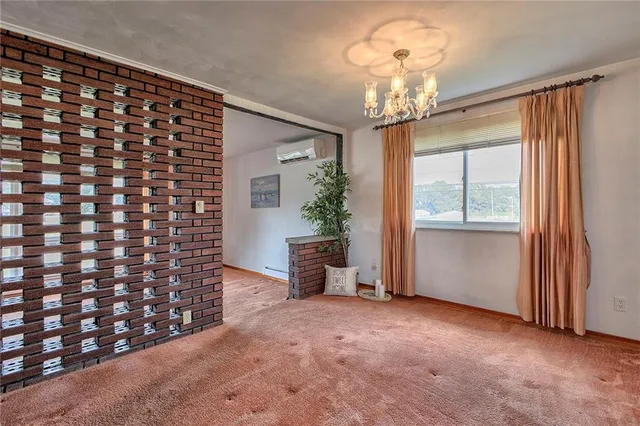 a view of a hallway with windows