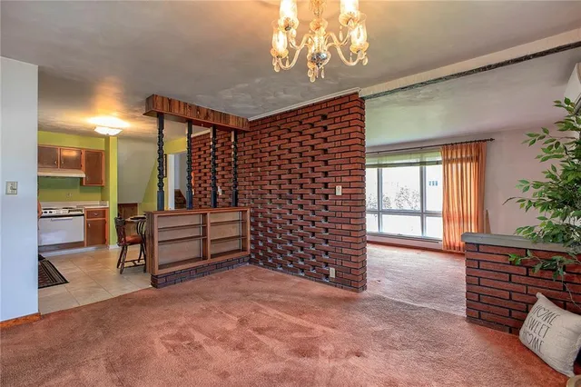 a kitchen with a table chairs and a sink