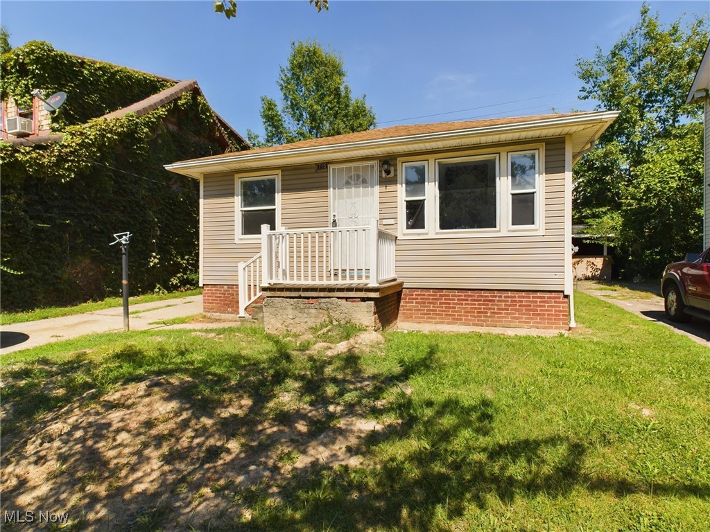 793 Alhambra Road Cleveland, OH 44110 - Photo 2 of 25 View of front of home featuring a front lawn
