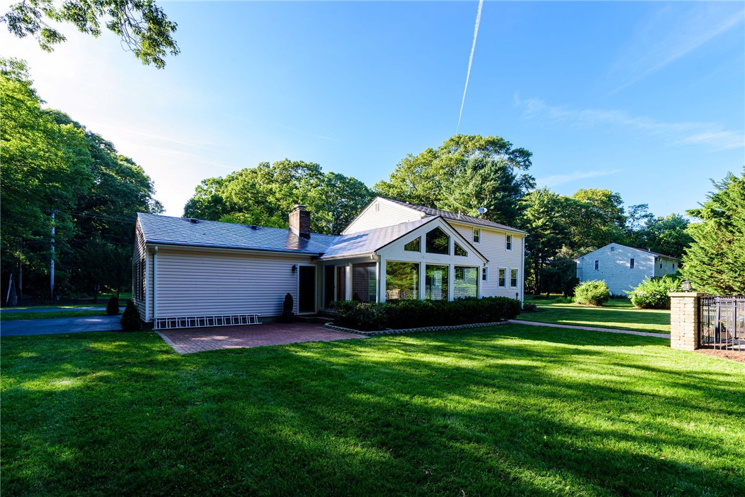 680 Fletcher Road North Kingstown, RI 02852 - Photo 3 of 41 Brick patio off 3 season room and you can see the stone pillars on right that enclose the inground pool