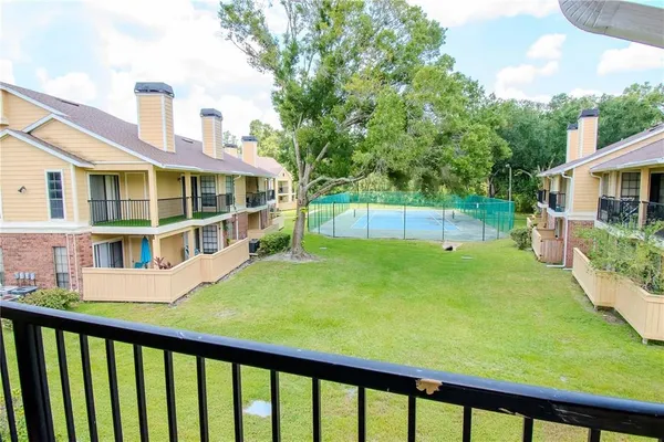 a view of a house with a backyard