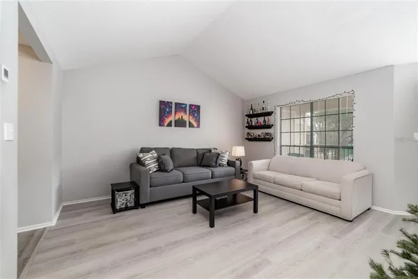 a living room with furniture and a large window