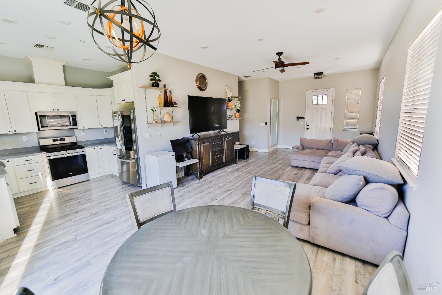 1331 Ridgecrest Court Santa Rosa, CA 95403 - Photo 2 of 19 a living room with furniture and a flat screen tv