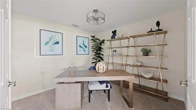 a view of a workspace with furniture