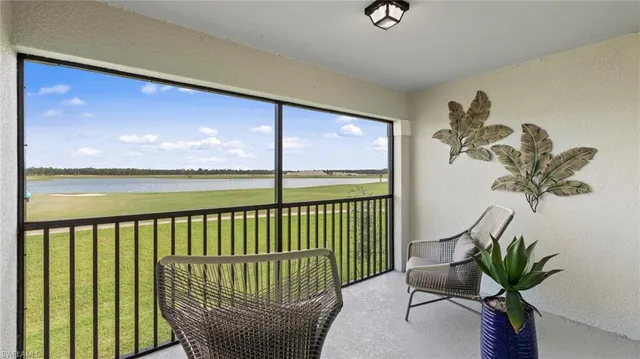 a view of a balcony with chair and table