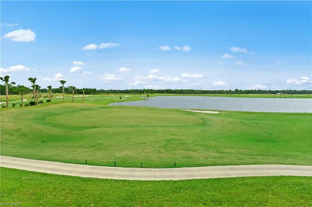 a view of a golf course with a lake