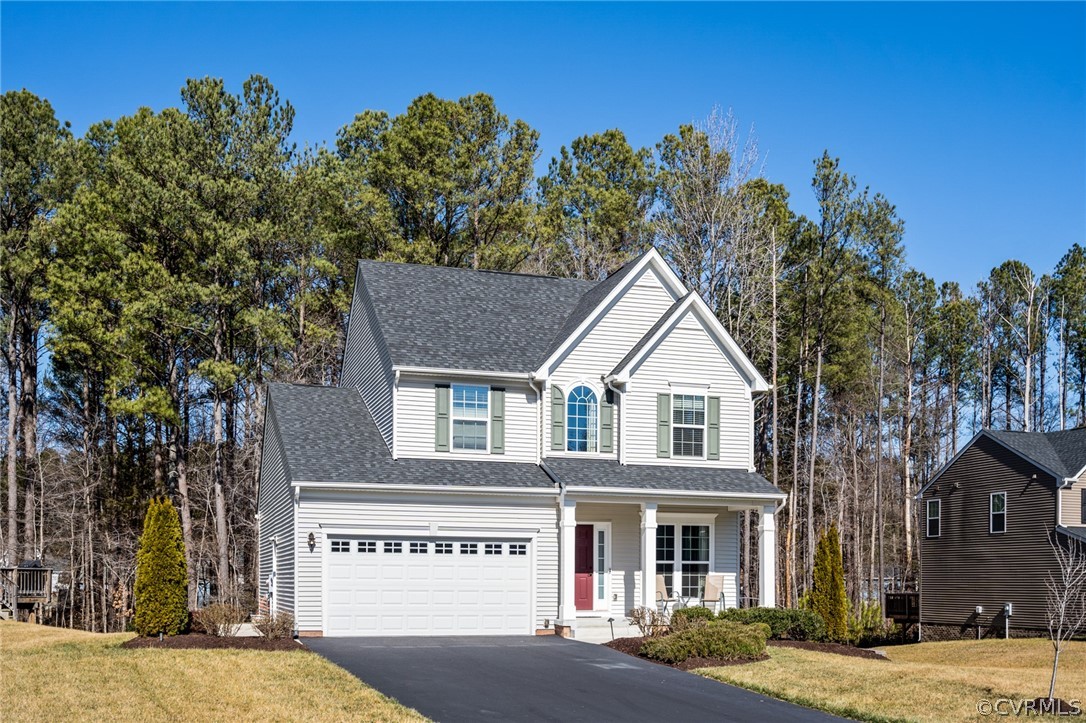10112 Sandy Ridge Drive Chesterfield, VA 23832 - Photo 3 of 34 a house with a tree in front of it