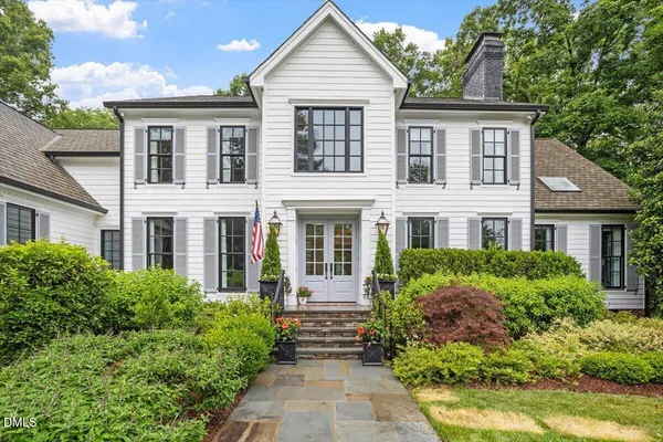 front view of a house with a garden